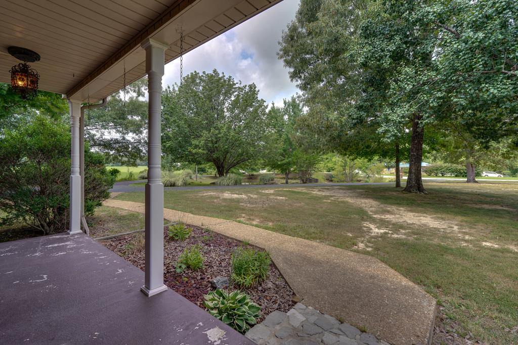 200 Coble Road Hohenwald, TN 38462 - Photo 6 of 29 a view of a yard with porch