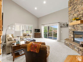 514 North Olympic Way Midway, UT 84049 - Photo 6 of 30 Spacious living area featuring a vaulted ceiling and recessed lighting