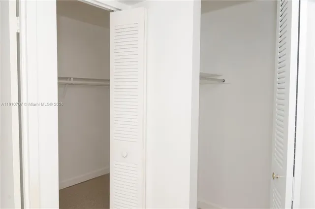 a view of an empty room with windows