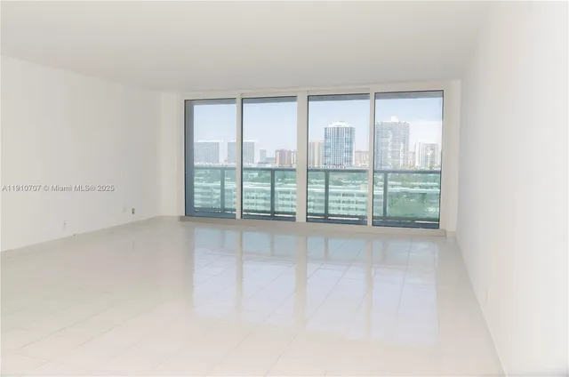 a view of an empty room with windows