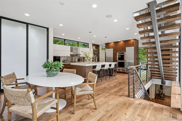 a view of a dining room with furniture water and kitchen view