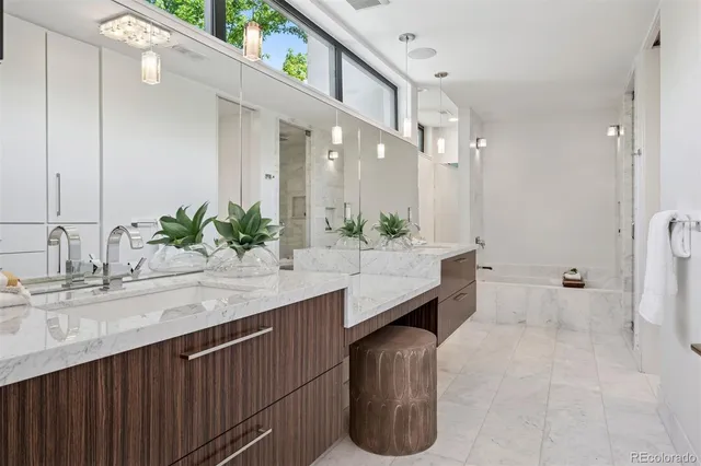 a living room with furniture wooden floor and a large window