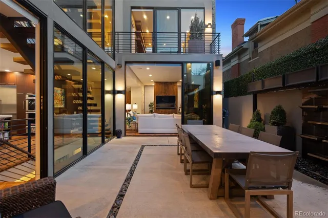 a patio with table and chairs