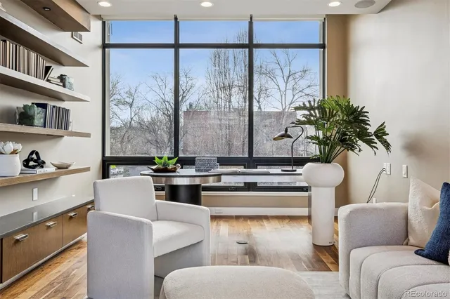 a view of a patio with table and chairs and wooden floor