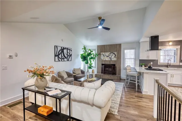 a living room with furniture fireplace and a couch