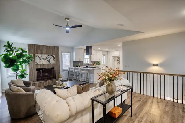 a kitchen with stainless steel appliances granite countertop a stove top oven a refrigerator a sink and a stove