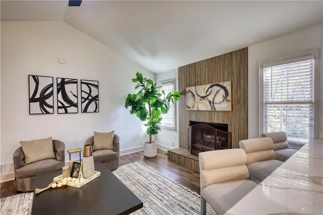 a kitchen with white cabinets and sink