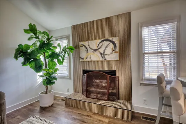 a kitchen with a stove sink and cabinets