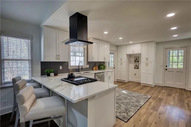 a view of a dining room with furniture and chandelier