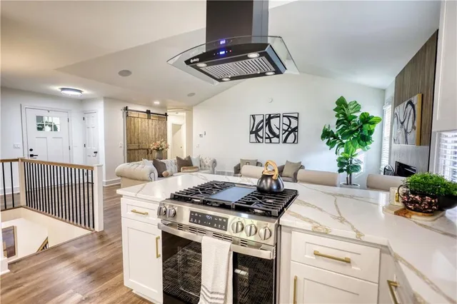 a dining room with furniture a chandelier and window