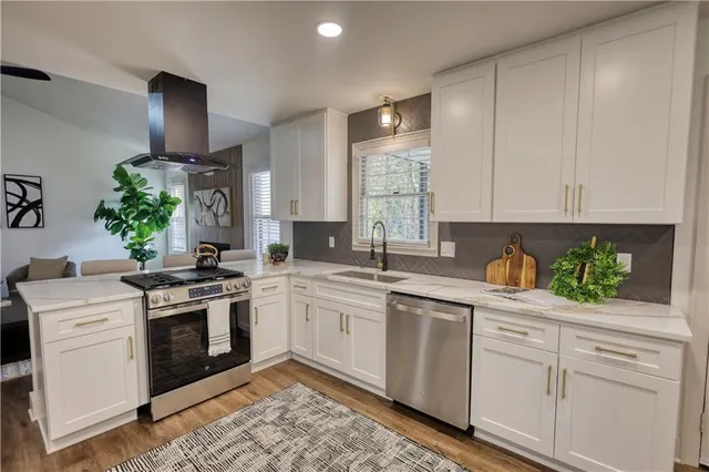 a view of a dining room with furniture wooden floor and chandelier