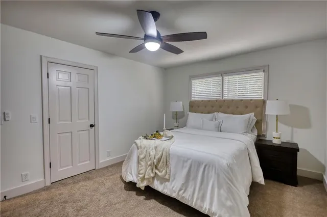 a bathroom with a toilet a sink a vanity and mirror