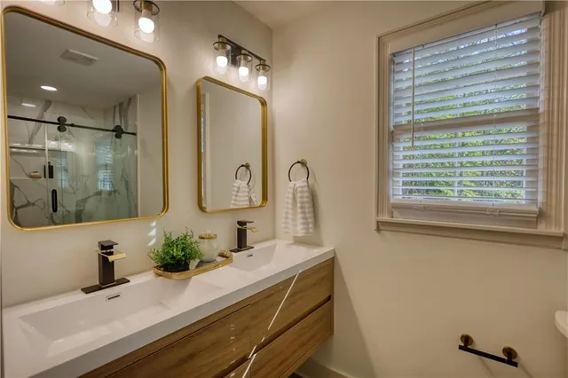 a view of a room with furniture and potted plant