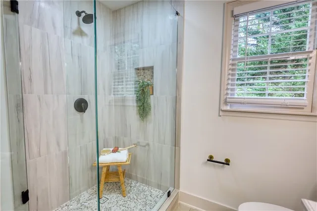 a view of a back yard of the house and tree