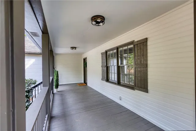 a living room with furniture a fireplace and kitchen view