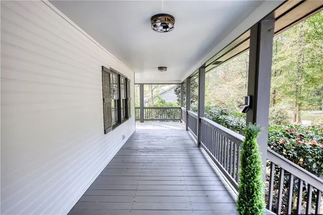 a living room with furniture a fireplace and a potted plant