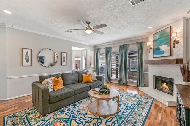 a living room with furniture and a fireplace