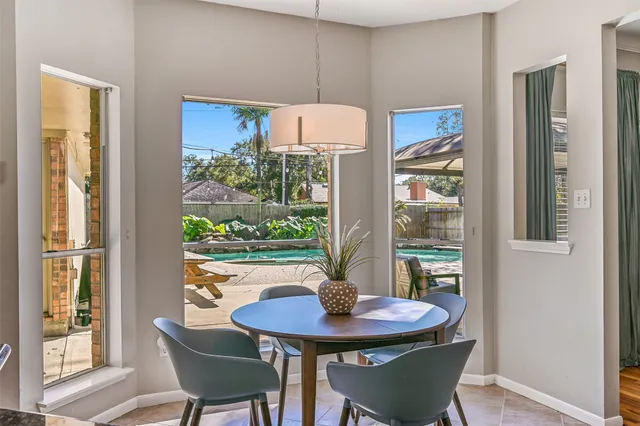 a view of a dining room with furniture window and outside view