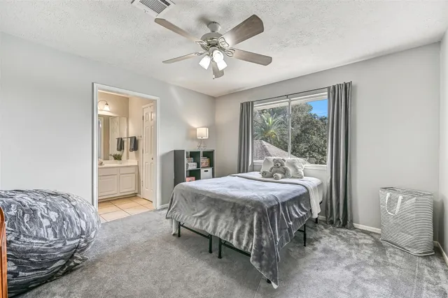 a bedroom with a bed and a table with closet