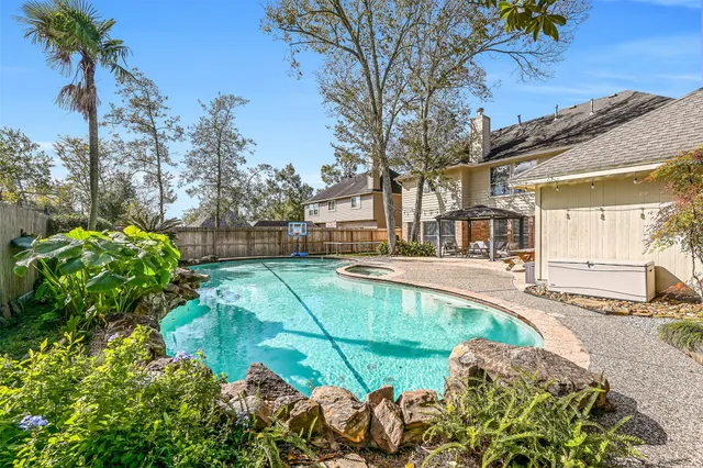 a view of a swimming pool with a patio