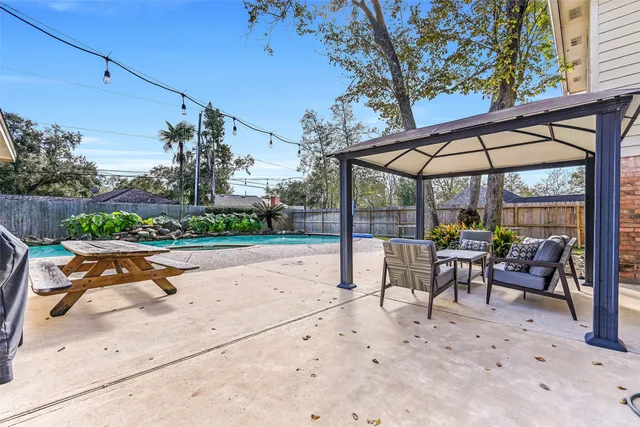 a glass bench sitting in front of a building