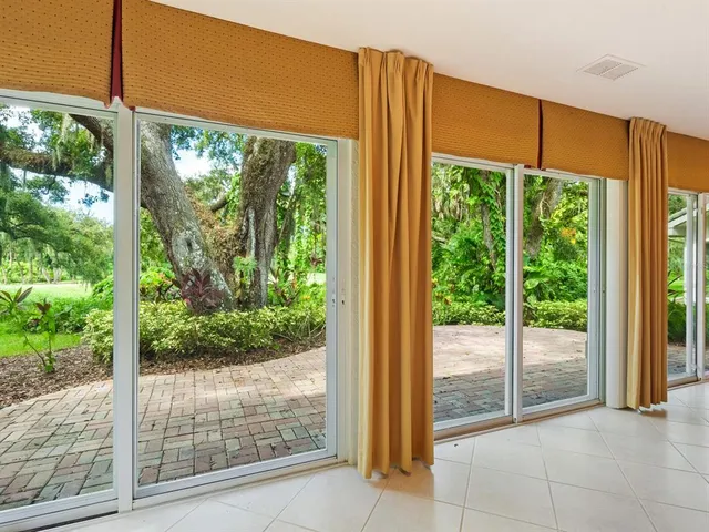 a view of a room that has a large window