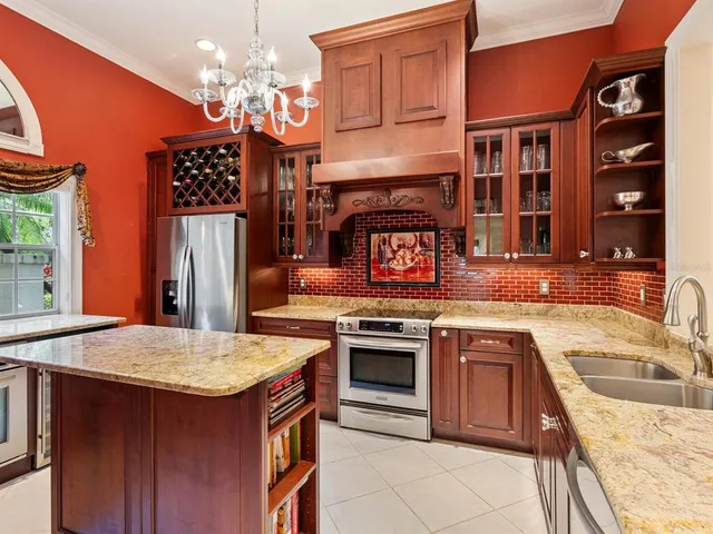 a kitchen with a sink stove and refrigerator