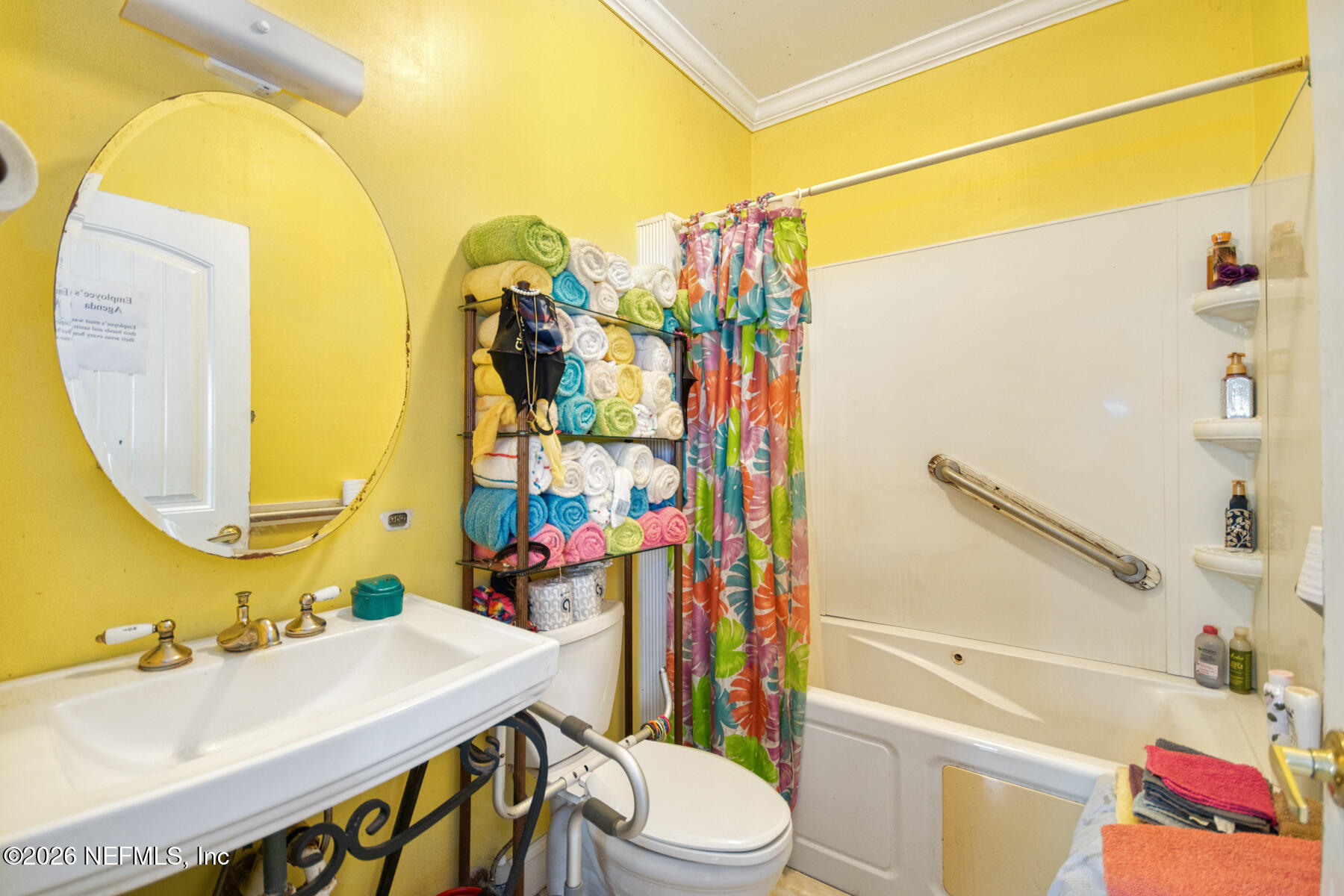 3704 Northeast Rocky Ford Road Madison, FL 32340 - Photo 13 of 34 a bathroom with a sink mirror vanity and toilet