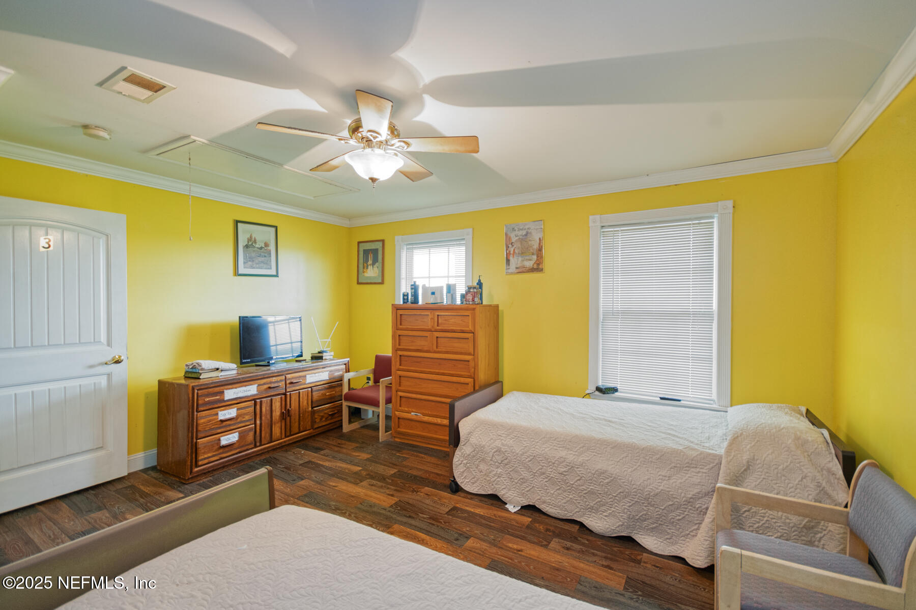 3704 Northeast Rocky Ford Road Madison, FL 32340 - Photo 23 of 34 a bedroom with a bed and wooden floor