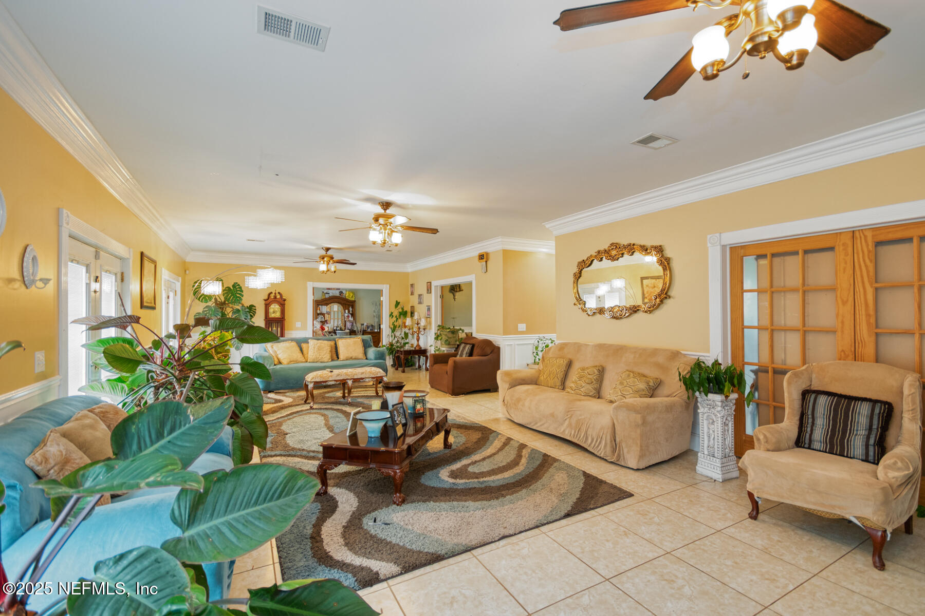 3704 Northeast Rocky Ford Road Madison, FL 32340 - Photo 9 of 34 a living room with patio furniture and a large window
