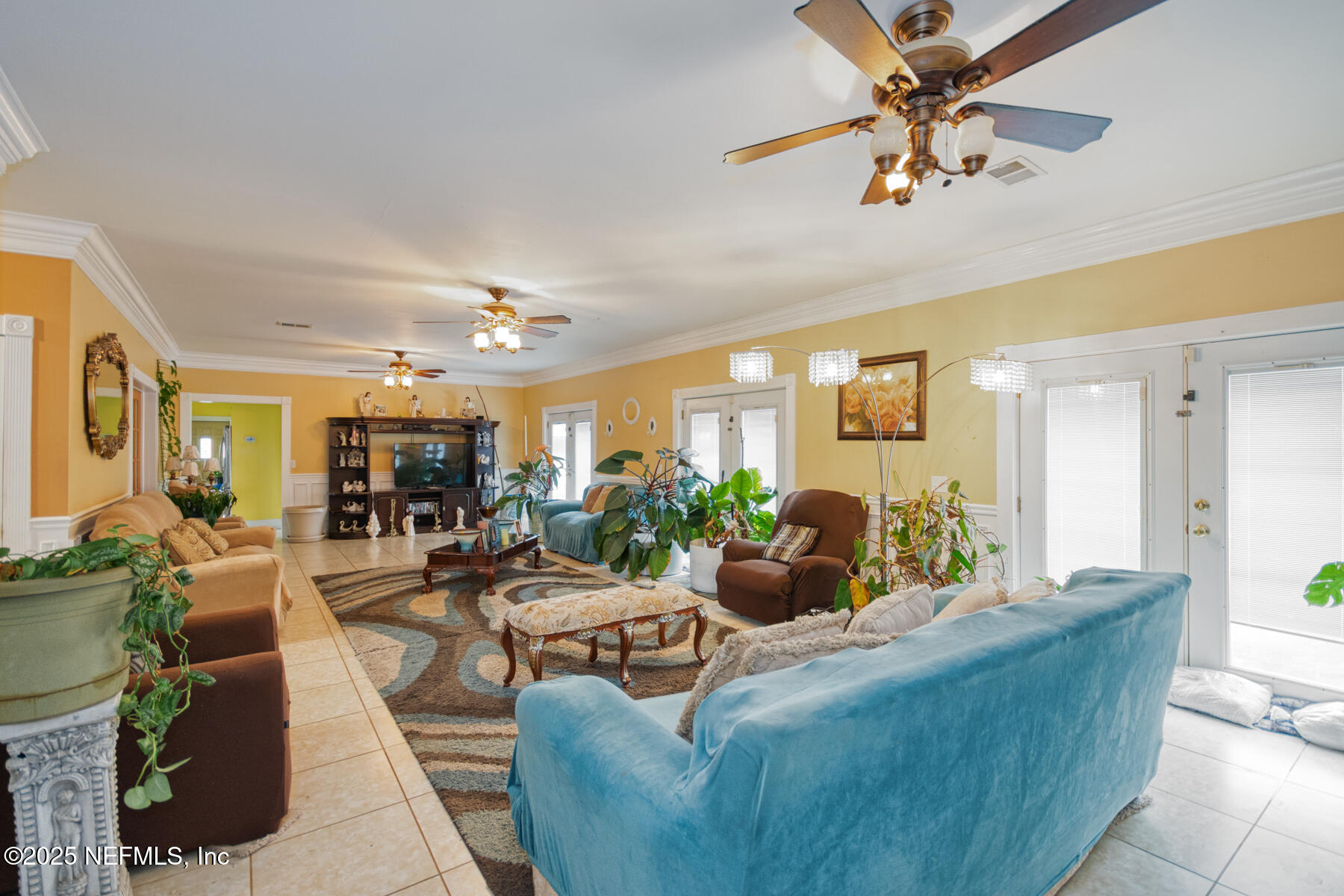 3704 Northeast Rocky Ford Road Madison, FL 32340 - Photo 10 of 34 a living room with furniture and a large window