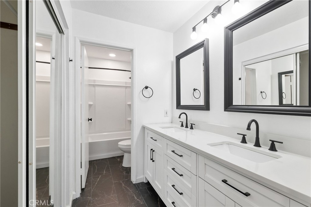 10 Timbre Rancho Santa Margarita, CA 92688 - Photo 13 of 24 a bathroom with a double vanity sink mirror and toilet