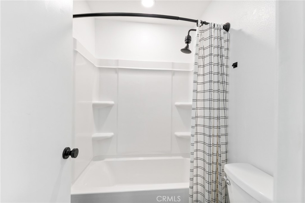 10 Timbre Rancho Santa Margarita, CA 92688 - Photo 13 of 24 a bathroom with a shower and a toilet