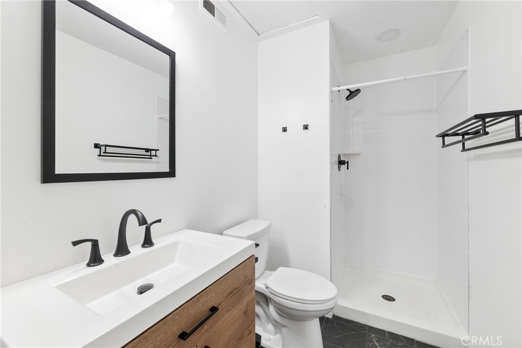 10 Timbre Rancho Santa Margarita, CA 92688 - Photo 16 of 24 a bathroom with a sink mirror and toilet
