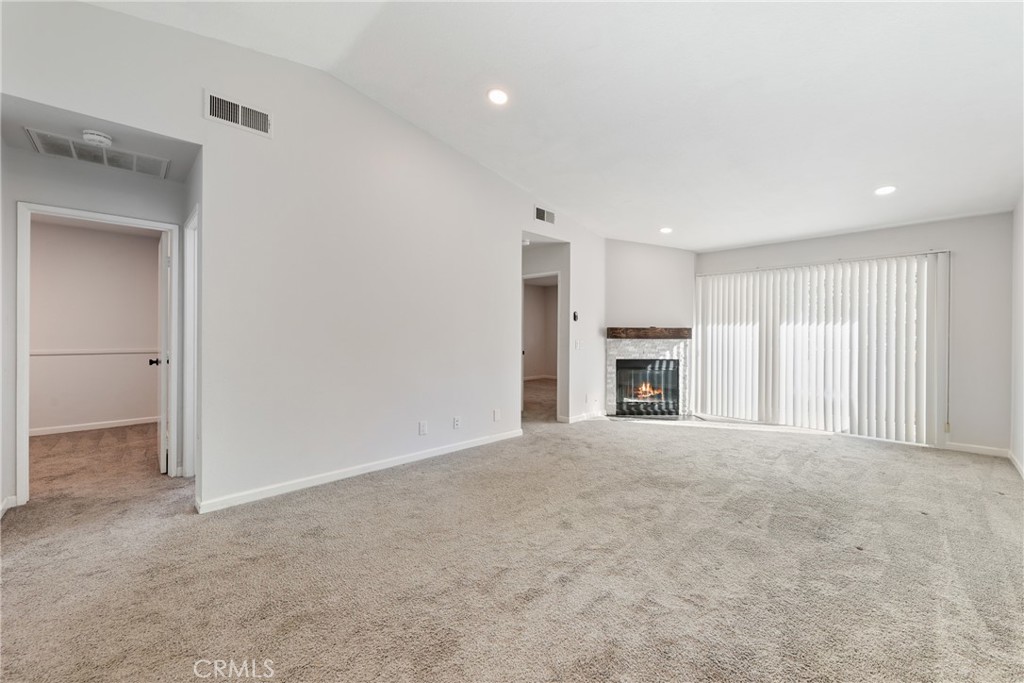 10 Timbre Rancho Santa Margarita, CA 92688 - Photo 6 of 24 a view of an empty room with a fireplace and a window
