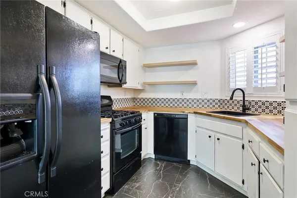 a view of a storage and utility room with closet
