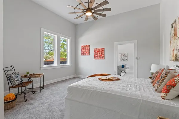 a bedroom with furniture and a window