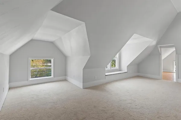 a view of empty room with a ceiling fan