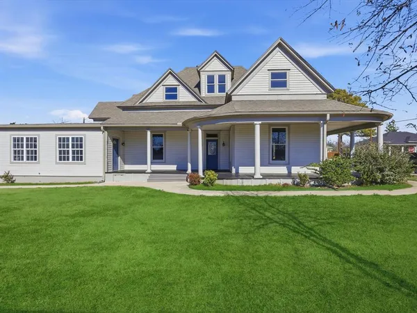 a backyard of a house with large trees