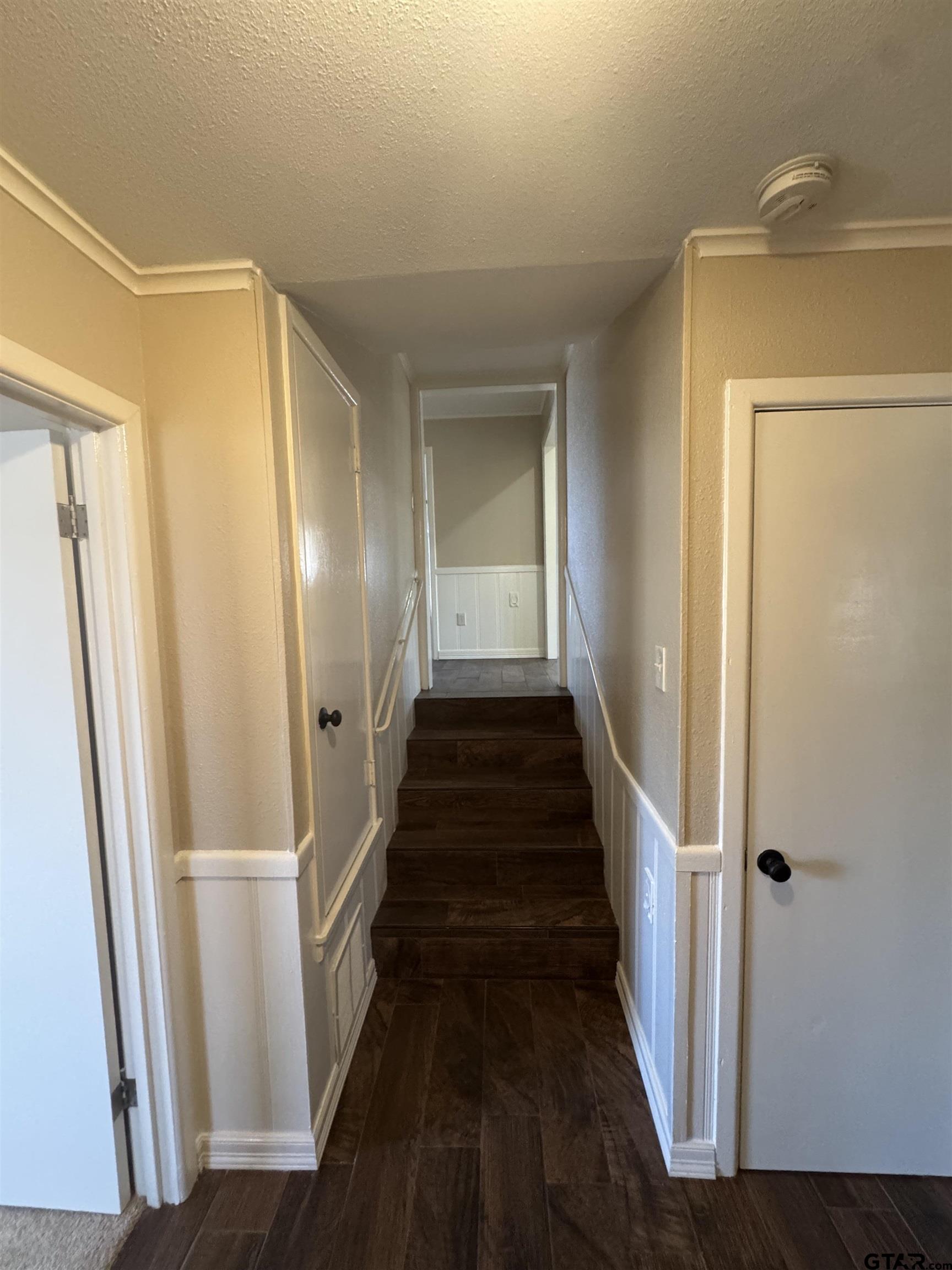 1823 Overbrook Drive Tyler, TX 75703 - Photo 18 of 48 a view of a hallway with wooden floor and staircase