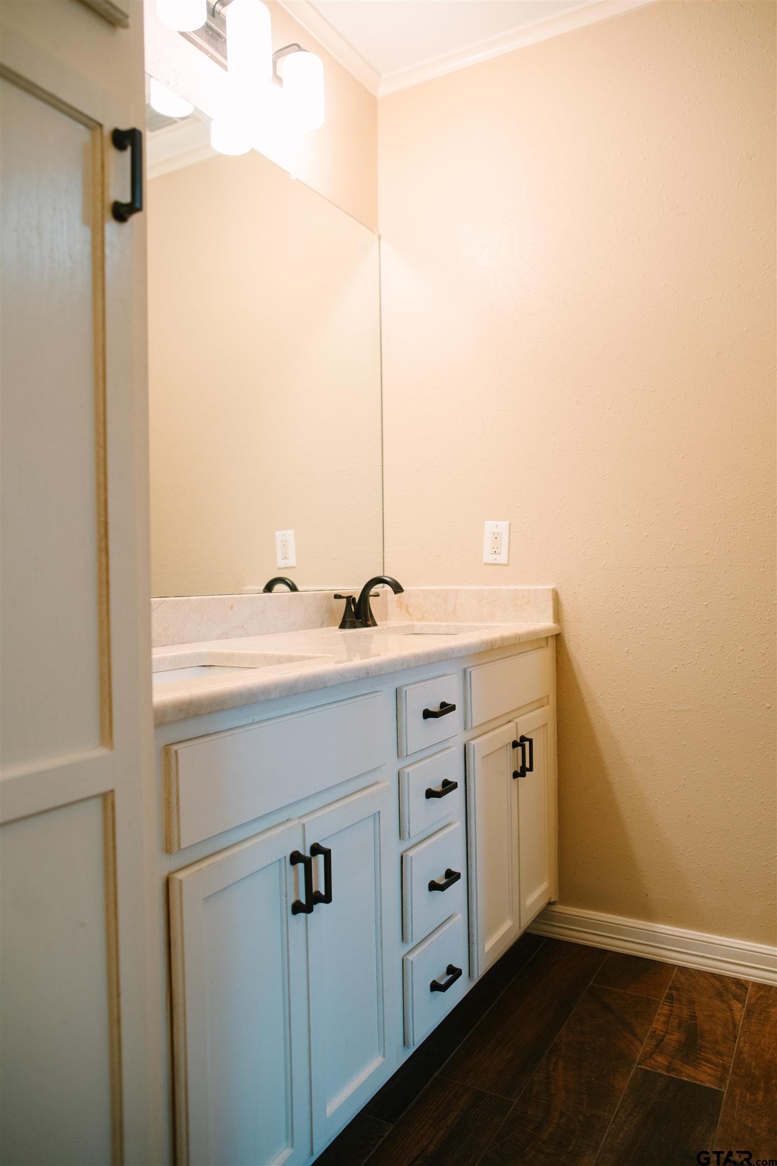 1823 Overbrook Drive Tyler, TX 75703 - Photo 20 of 48 a bathroom with a sink and a mirror