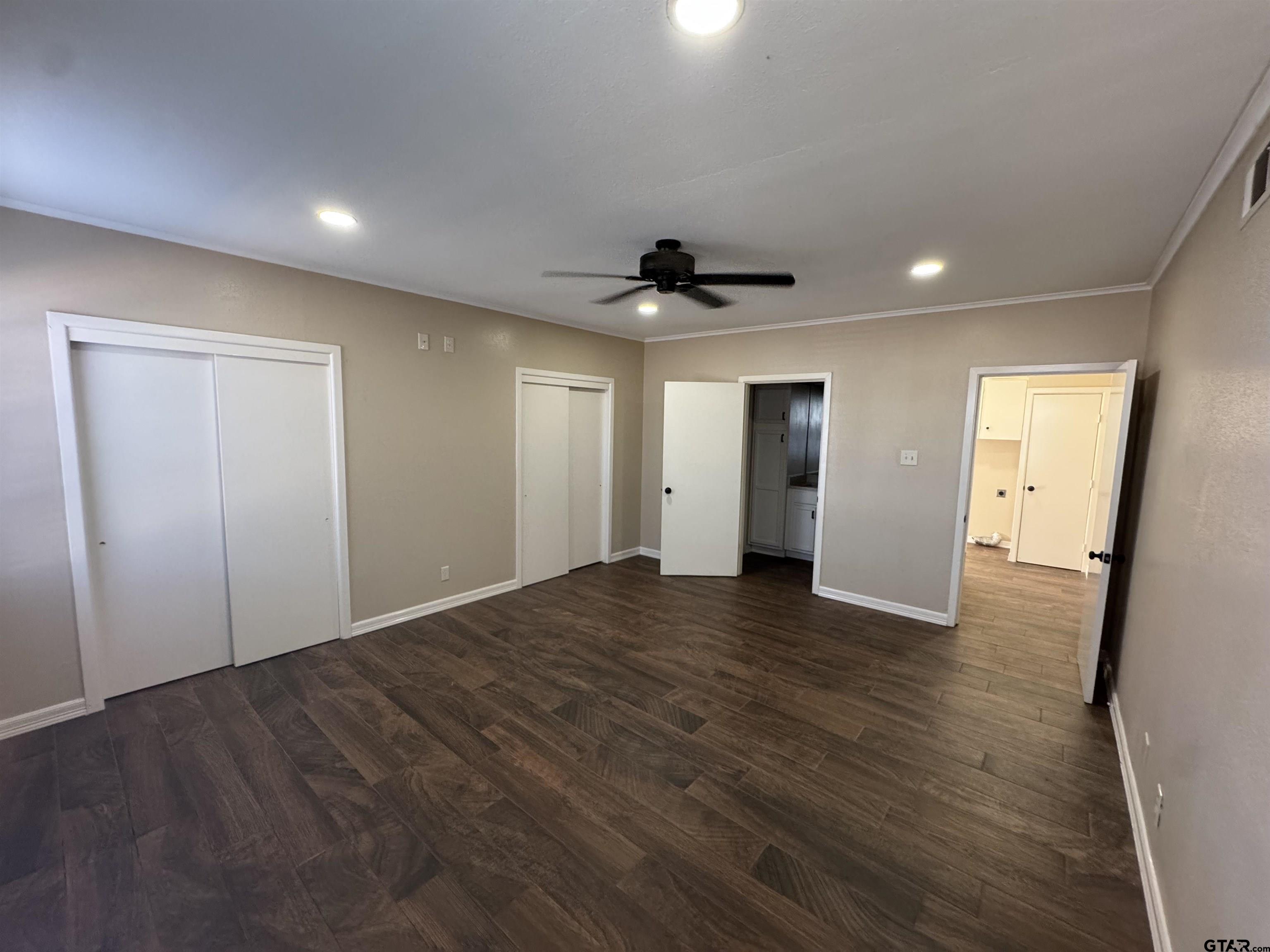 1823 Overbrook Drive Tyler, TX 75703 - Photo 32 of 48 a view of an empty room with wooden floor and a window