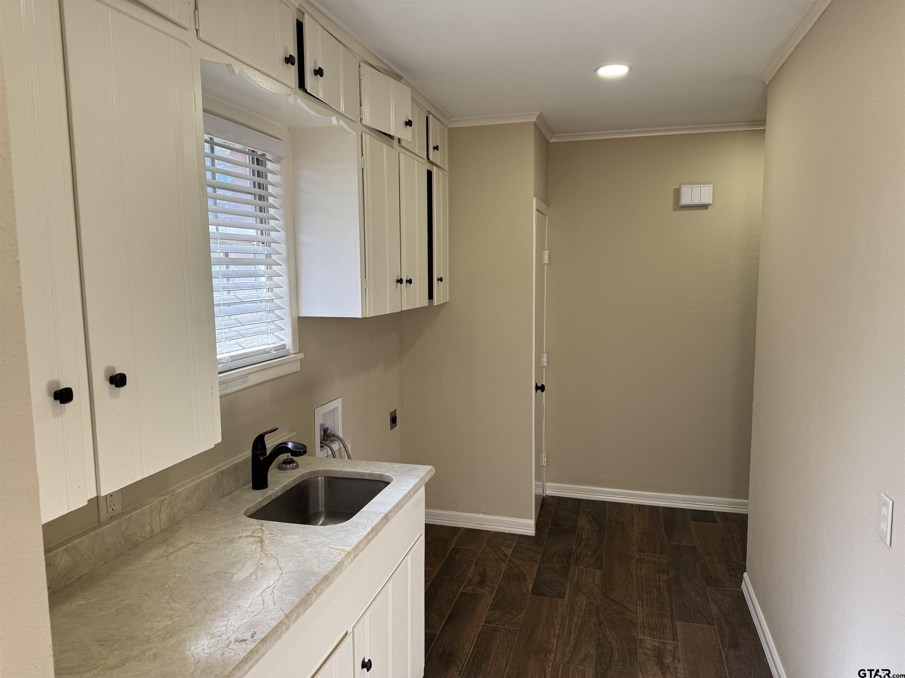 1823 Overbrook Drive Tyler, TX 75703 - Photo 36 of 48 a kitchen with stainless steel appliances a sink a stove and cabinets