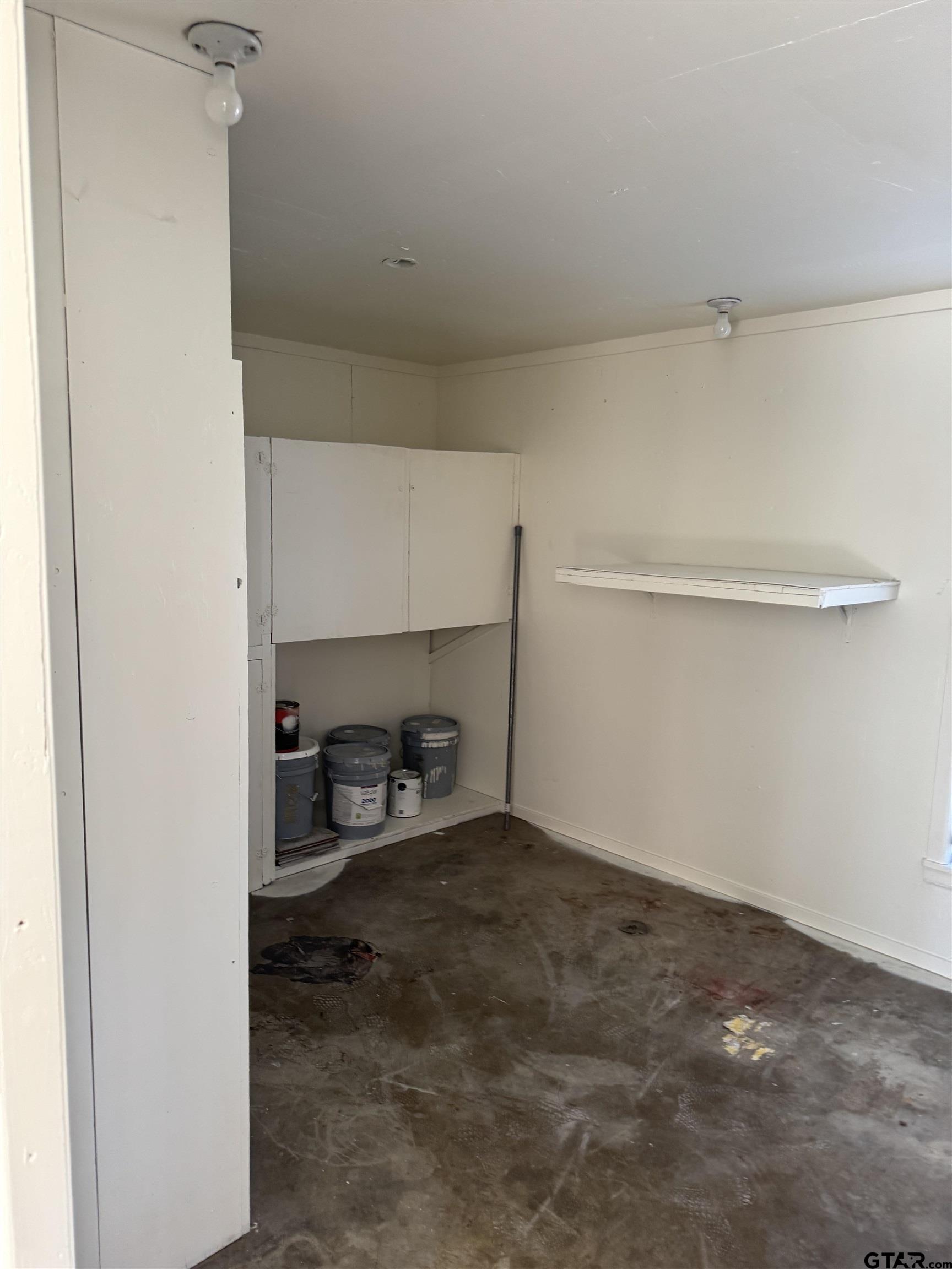 1823 Overbrook Drive Tyler, TX 75703 - Photo 39 of 48 a view of storage and utility room with two washing machine