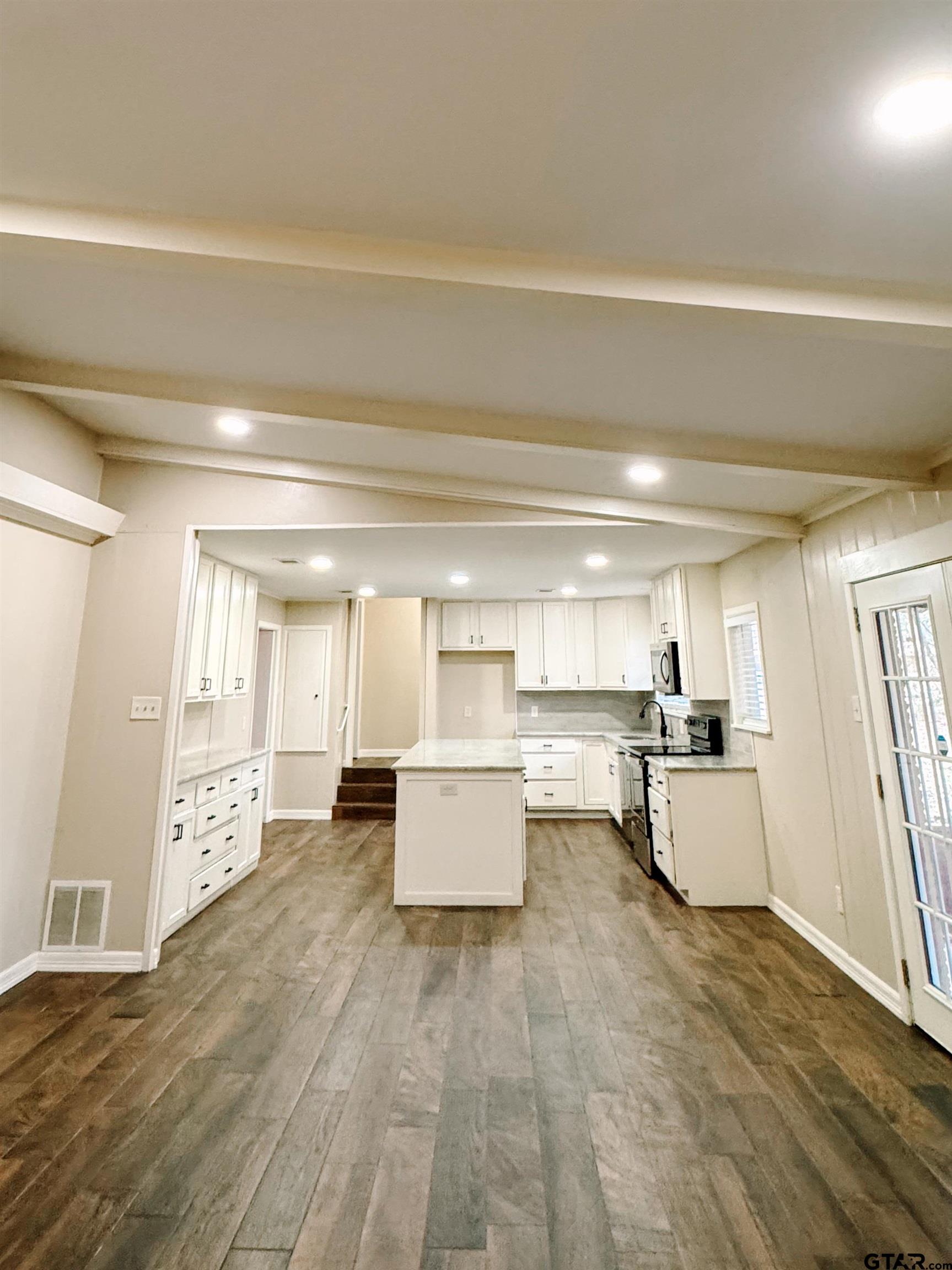 1823 Overbrook Drive Tyler, TX 75703 - Photo 4 of 48 a living room with furniture and wooden floor