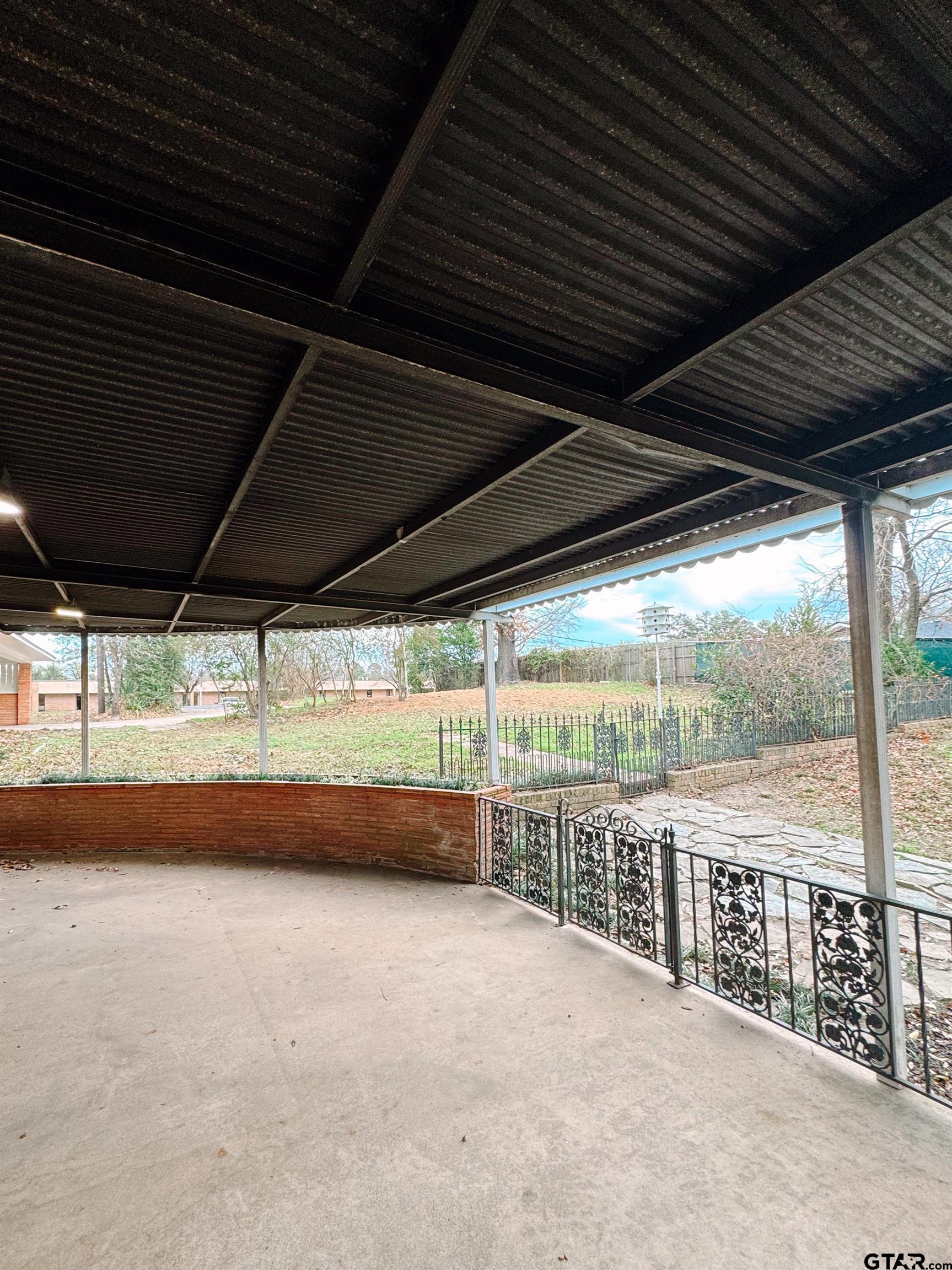 1823 Overbrook Drive Tyler, TX 75703 - Photo 41 of 48 a view of an empty room with a large window