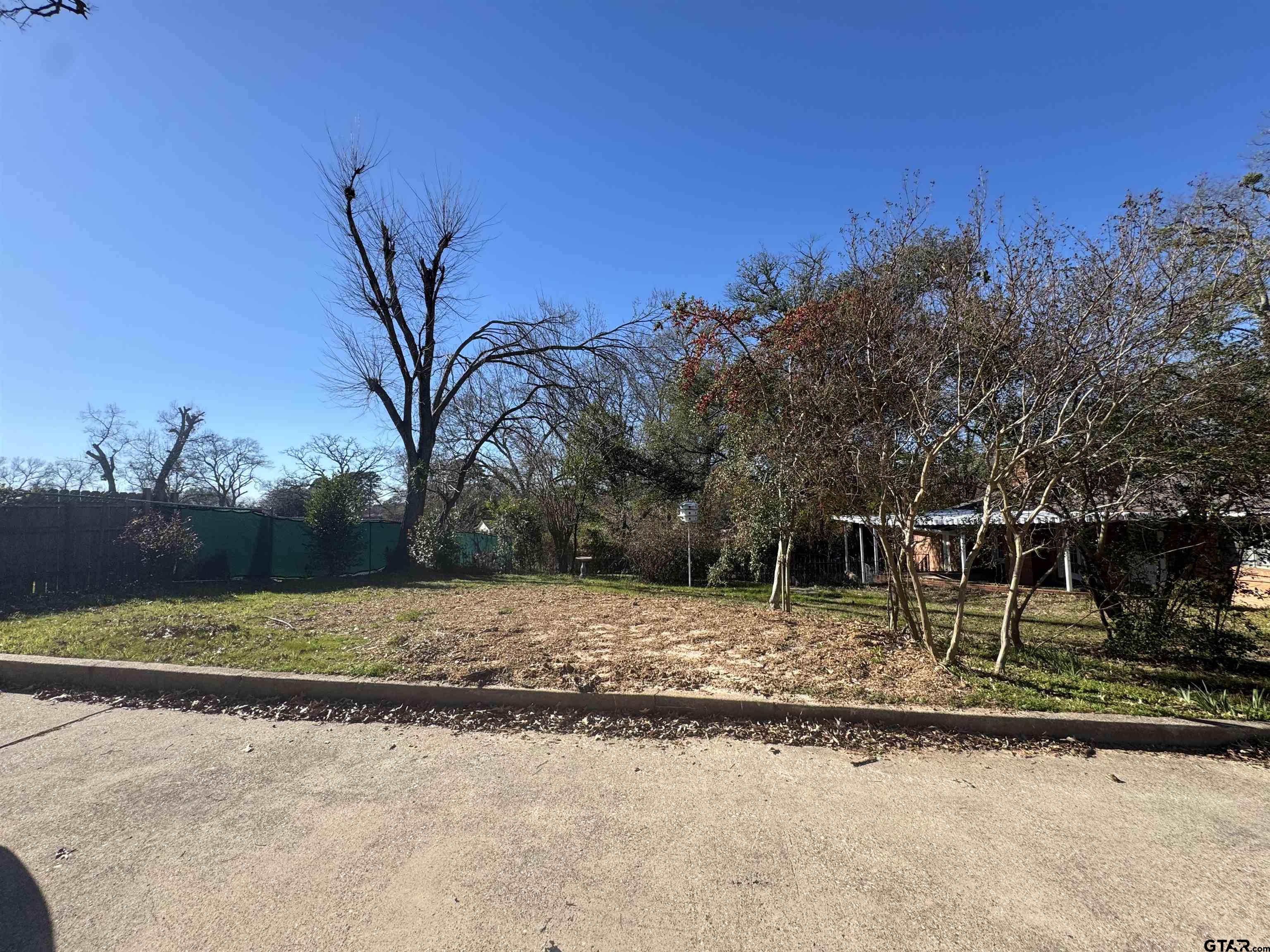 1823 Overbrook Drive Tyler, TX 75703 - Photo 48 of 48 a house with trees in the background