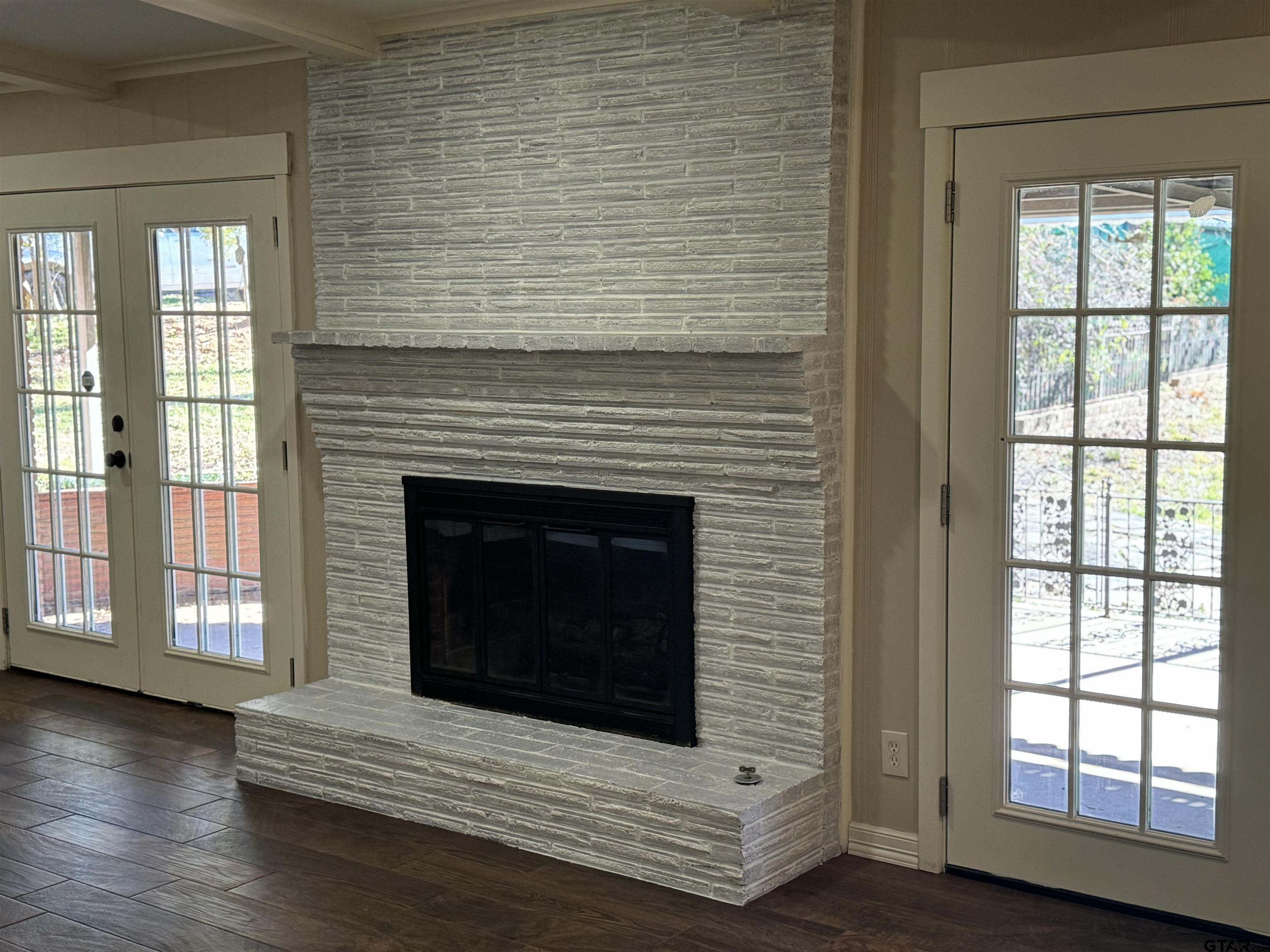 1823 Overbrook Drive Tyler, TX 75703 - Photo 7 of 48 a room with fireplace and a wooden floor