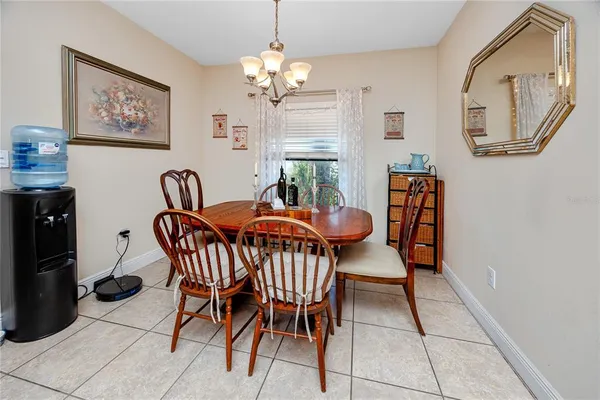 a dining room with furniture and window