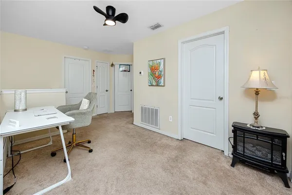 a view of a workspace with furniture